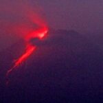Indonesian volcano churns out fresh clouds of ash, lava