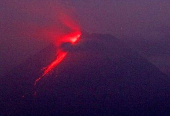 Indonesian volcano churns out fresh clouds of ash, lava